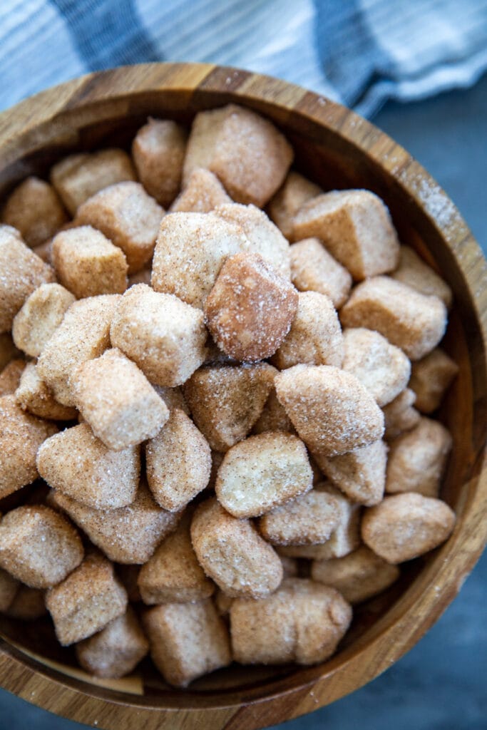 monkey bread dough with cinnamon and sugar in bowl