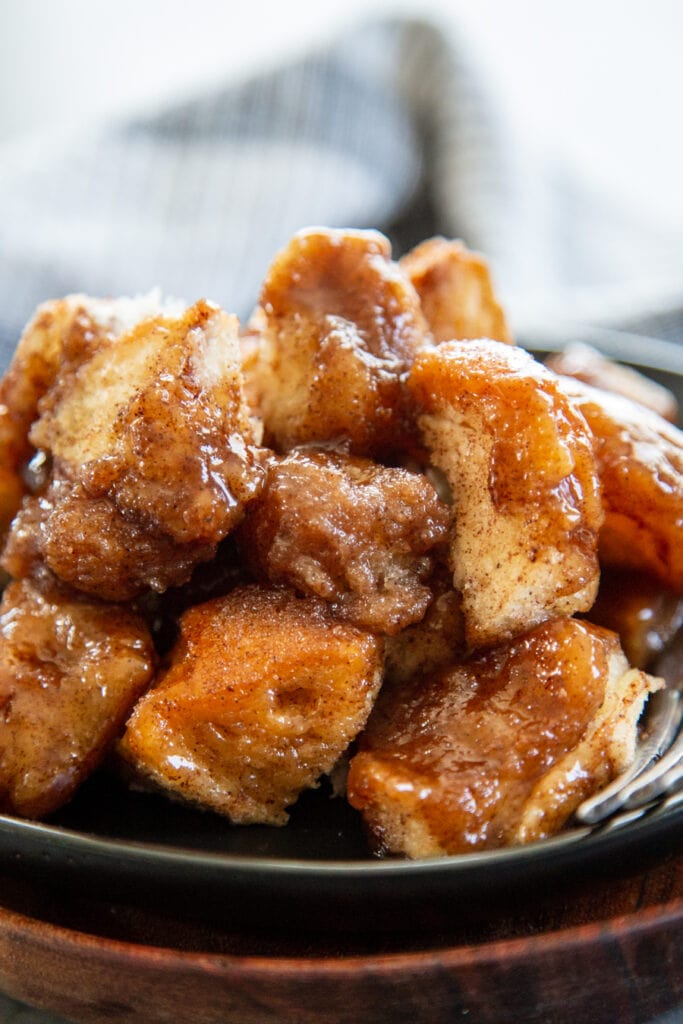 close up shot of monkey bread on black plate