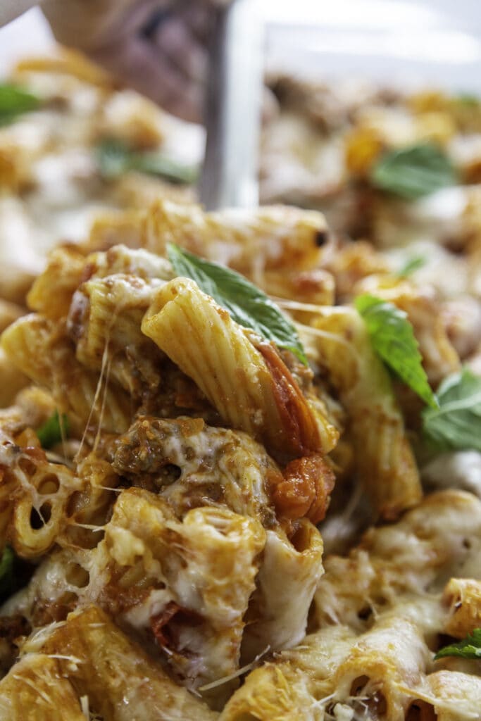 pasta with spoon and cheese