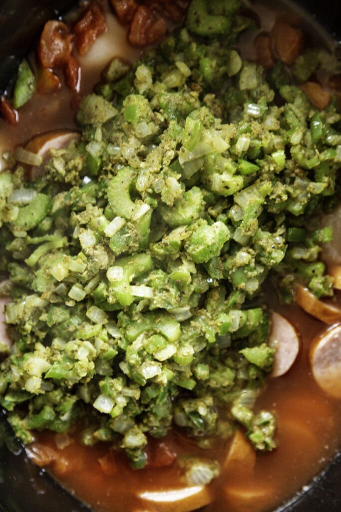 slow cooker with gumbo ingredients raw