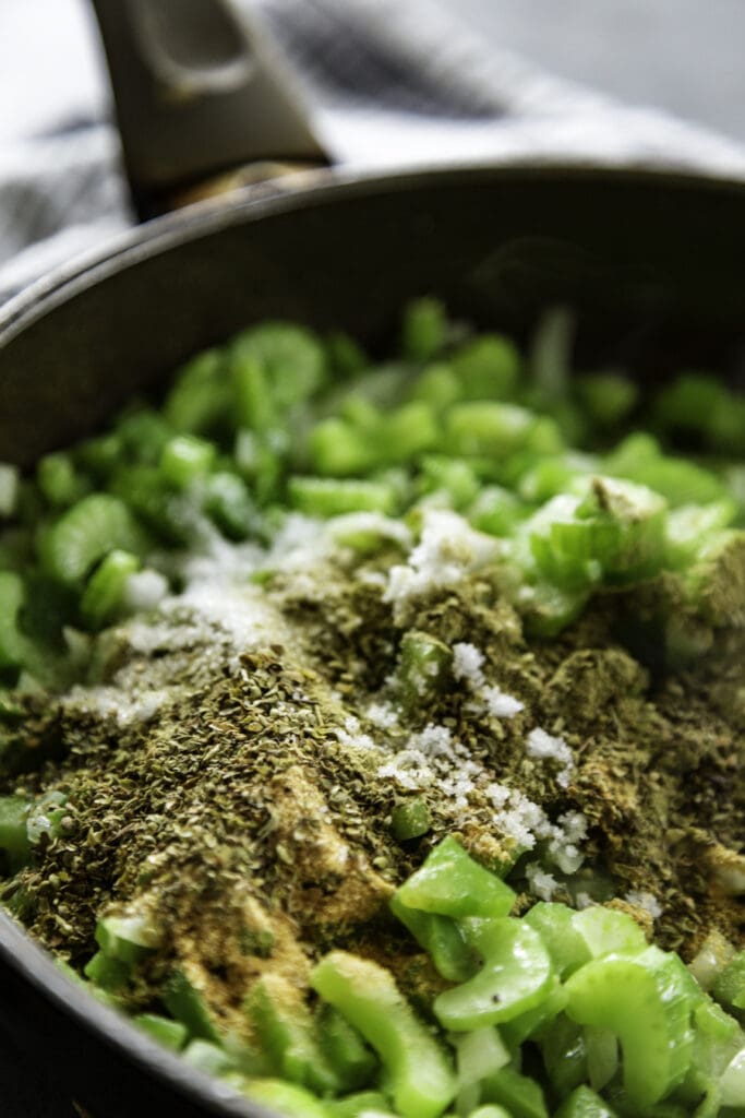 skillet with seasonings, celery and onion