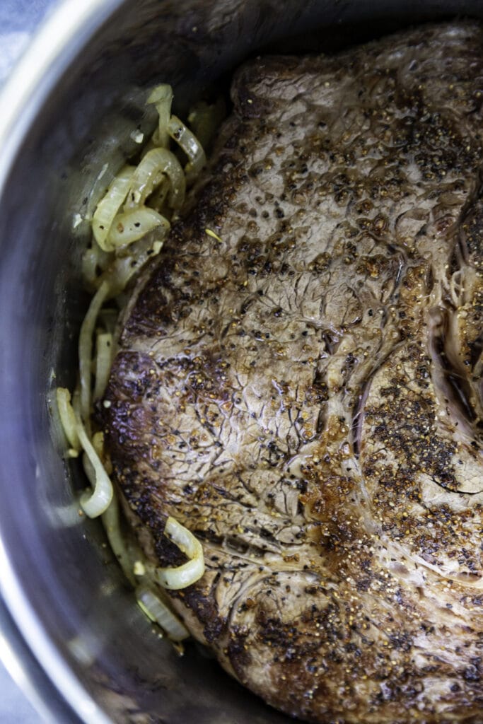 beef roast cooked with onions