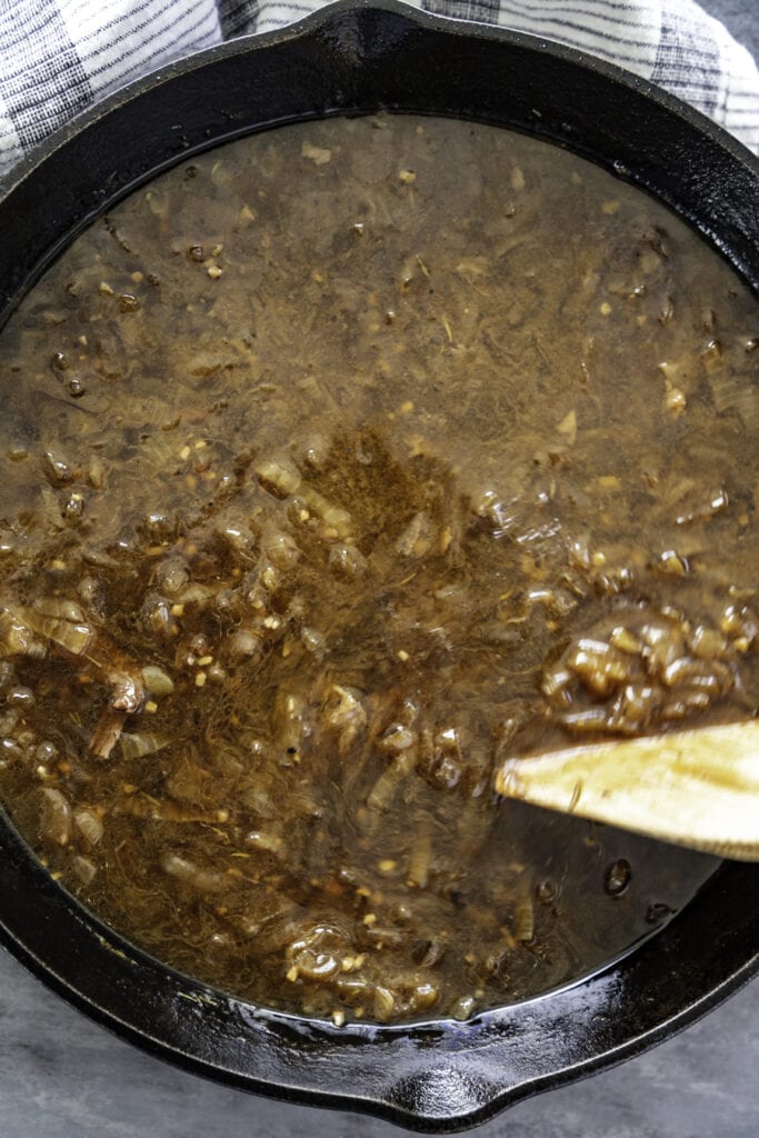 overhead shot of instant pot with onions and aujus