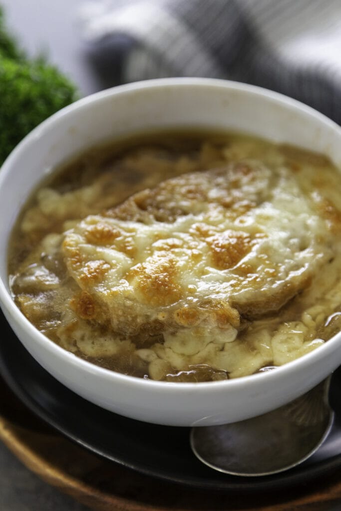 bowl of soup with melted cheese