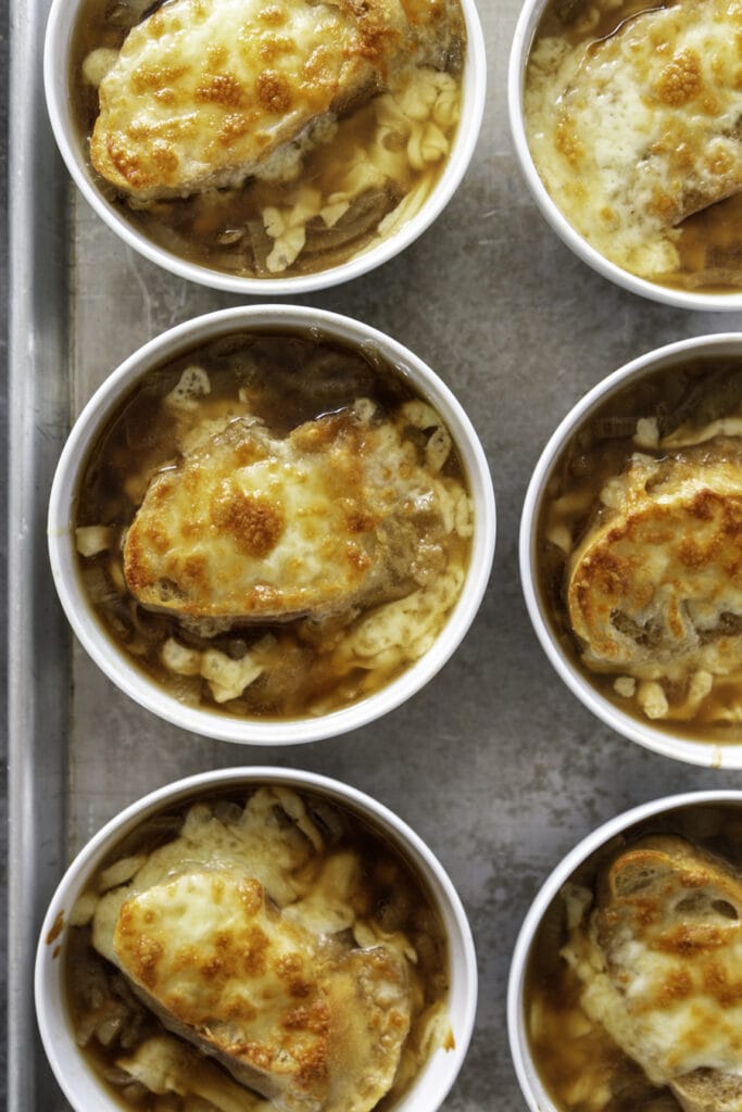 small bowls with onion soup with melted, toasty cheese 