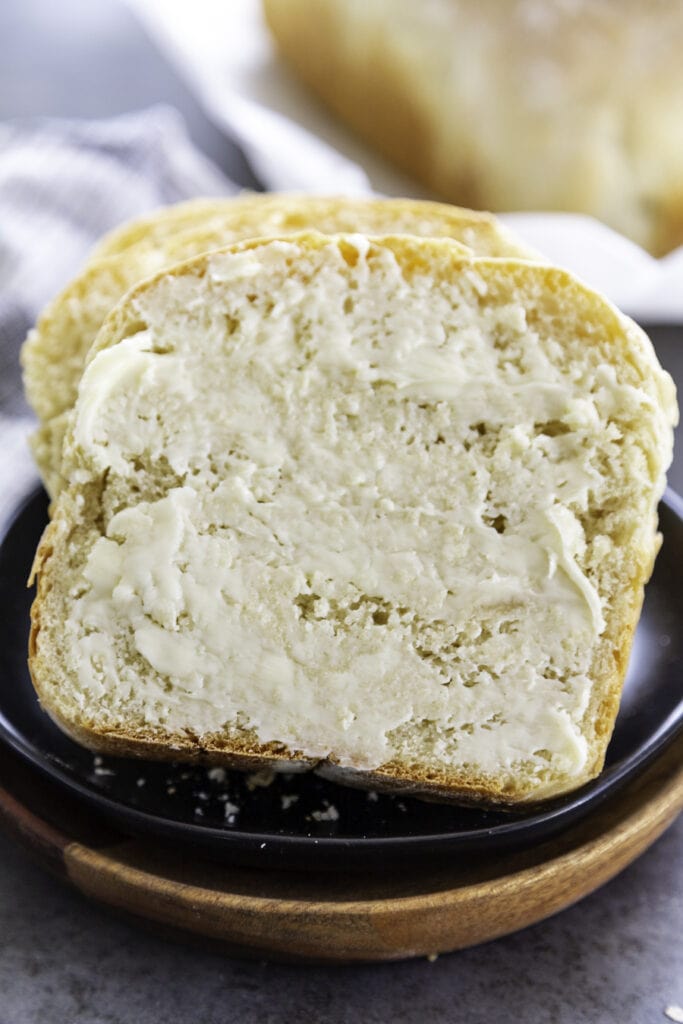 two slices of homemade white bread with butter