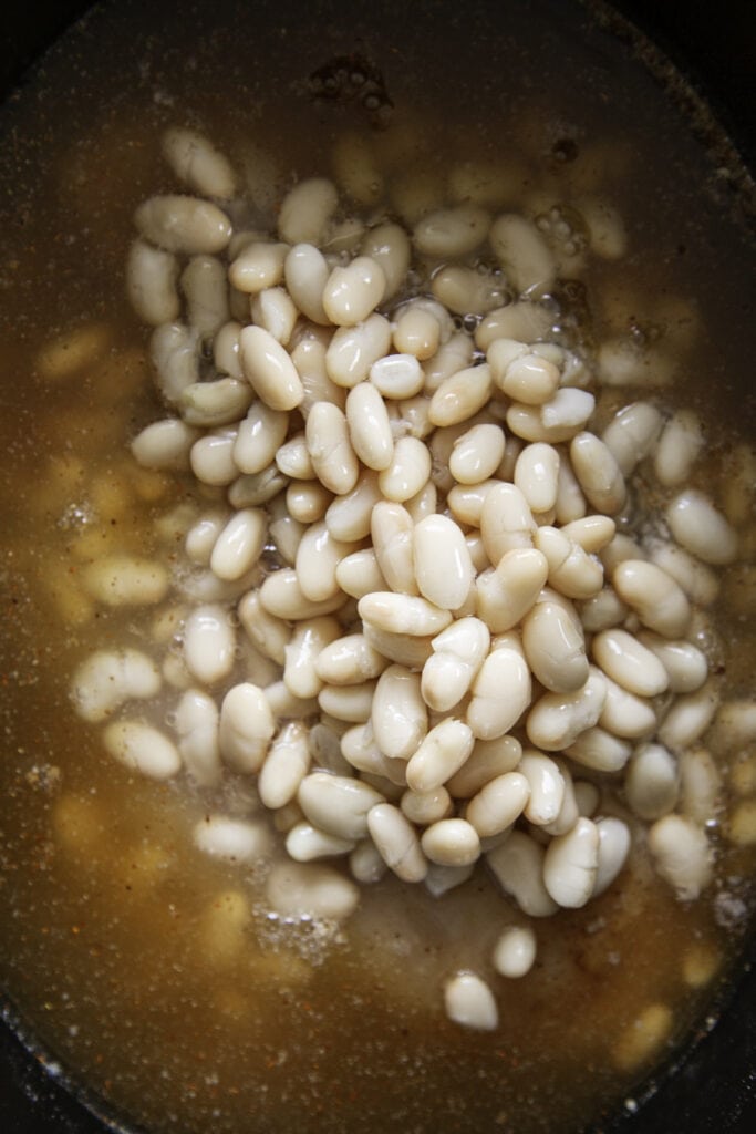 white beans in slow cooker with broth