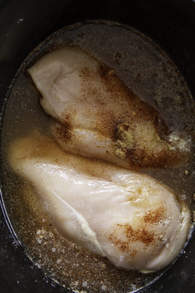 chicken with chicken broth and seasonings