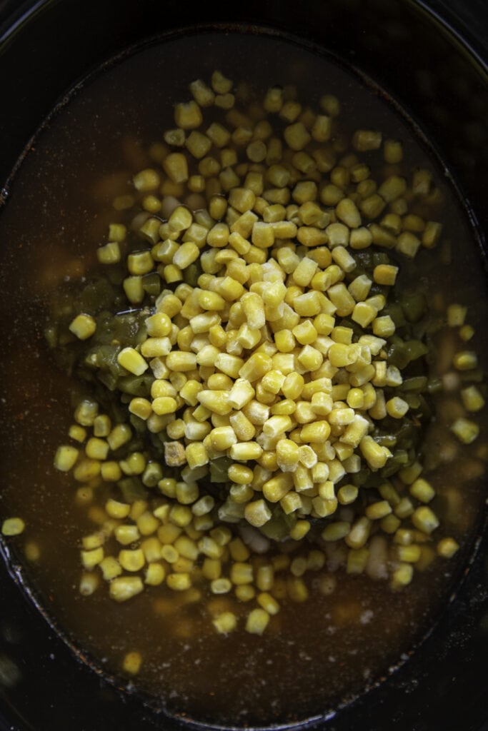 corn over green chiles and beans in slow cooker