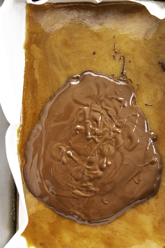 overhead shot of melted chocolate over toffee