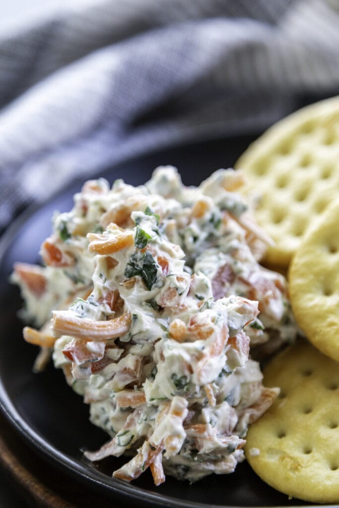 veggie cream cheese on plate with crackers