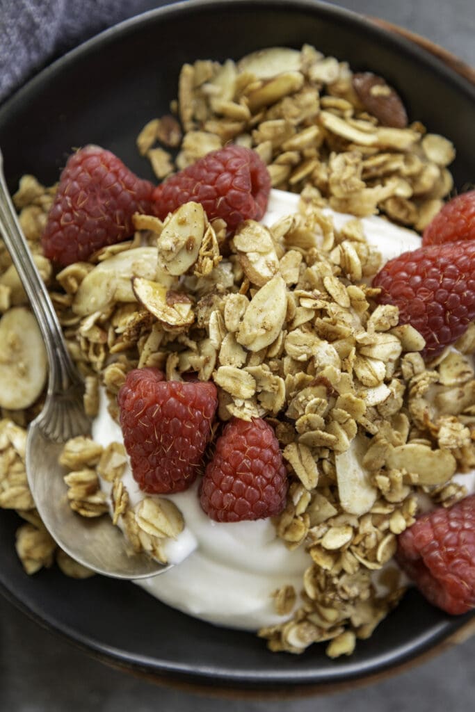 plate with granola and berries