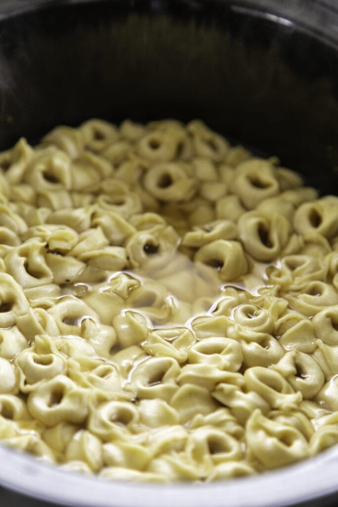 overhead shot of tortellini in broth