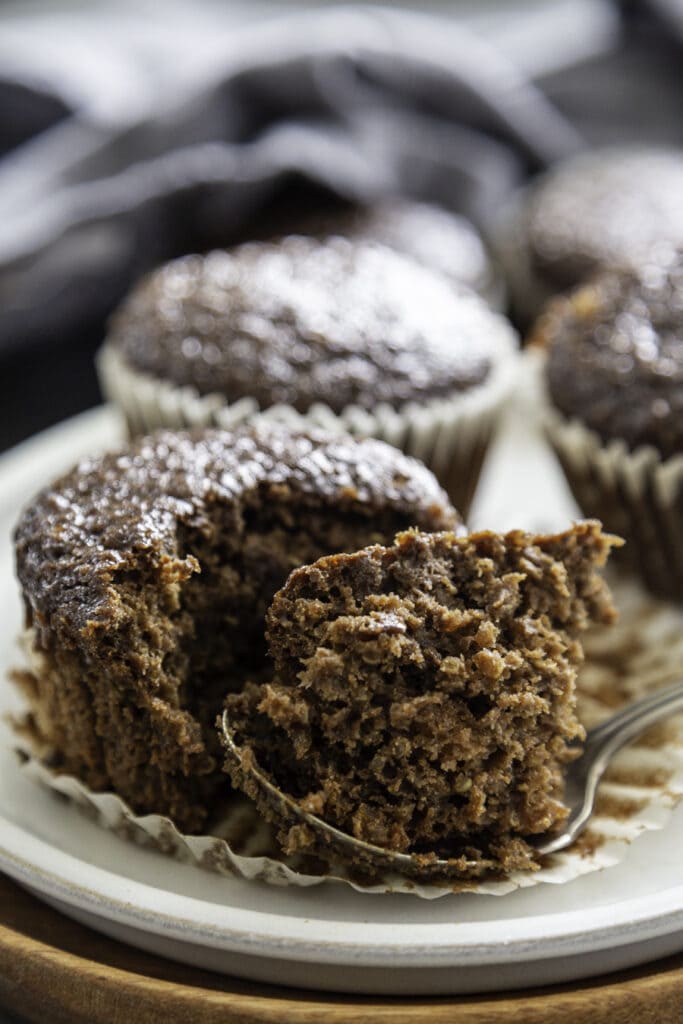 chocolate muffins with bite taken out with fork