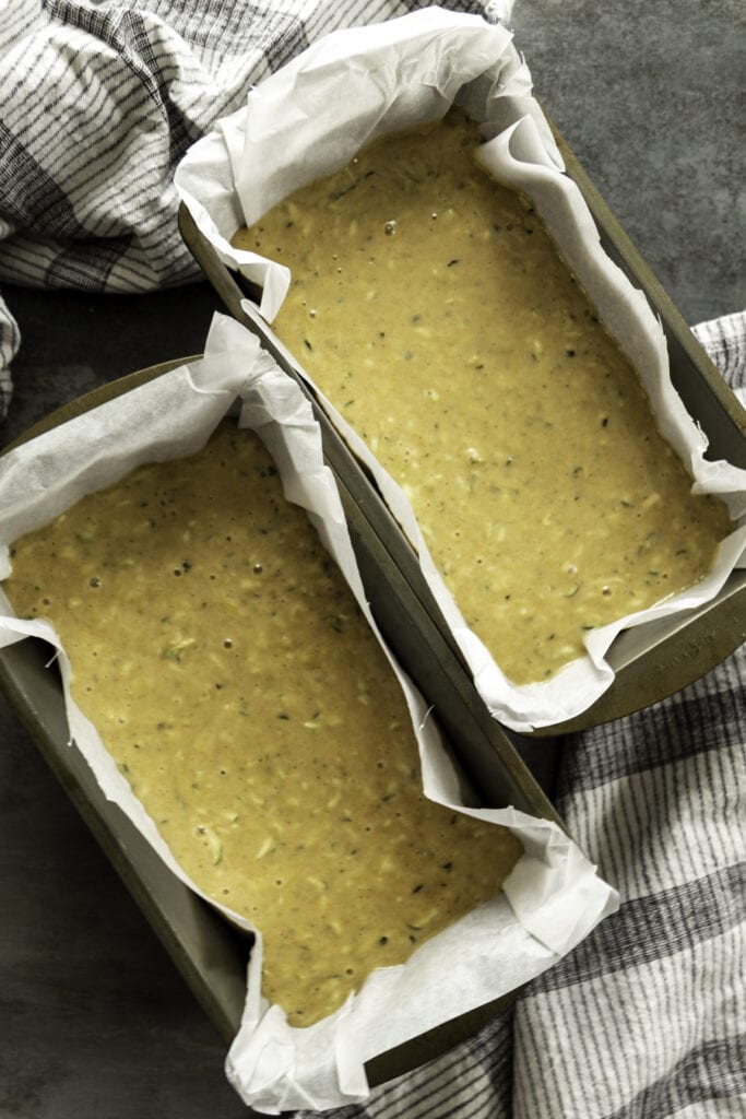 zucchini banana bread batter in bread pans