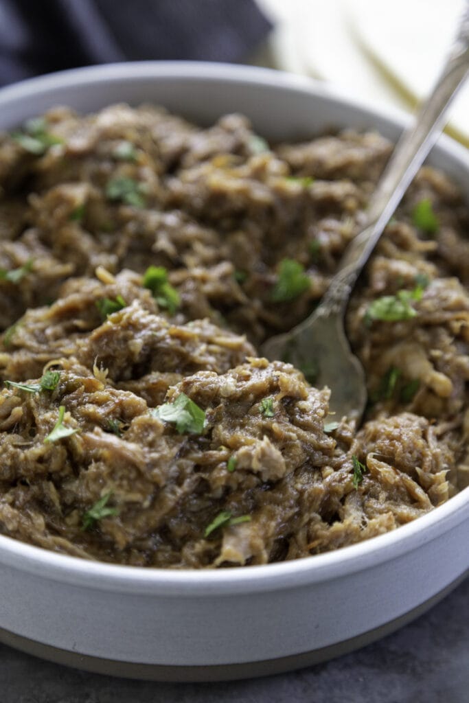 bowl of pork with serving fork