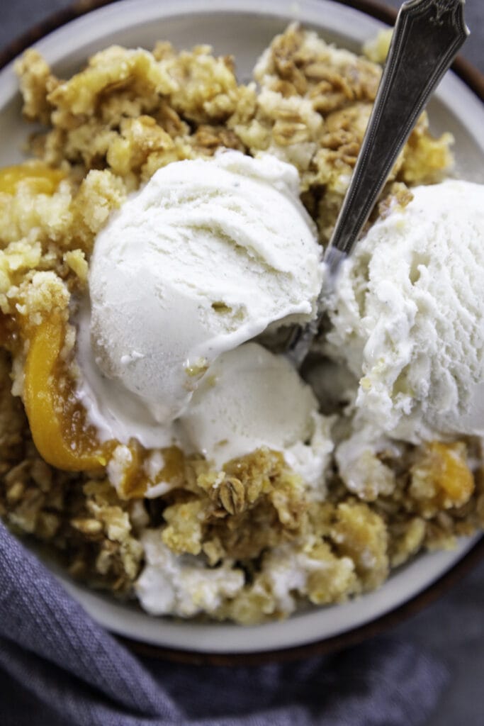 overhead shot peach cake with ice cream