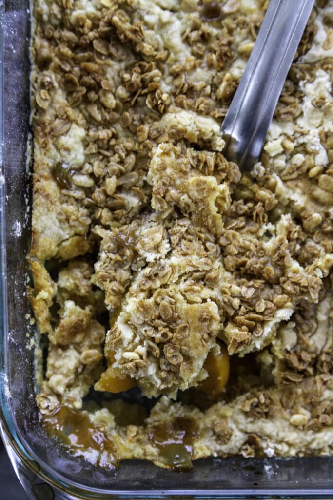 overhead shot peach dump cake in baking pan