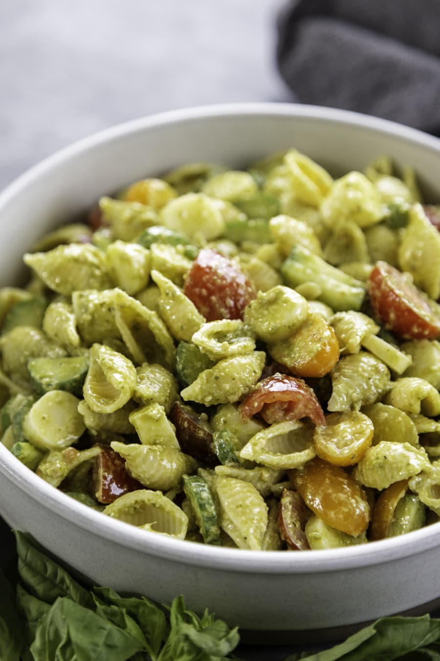 bowl of pesto pasta salad with veggies