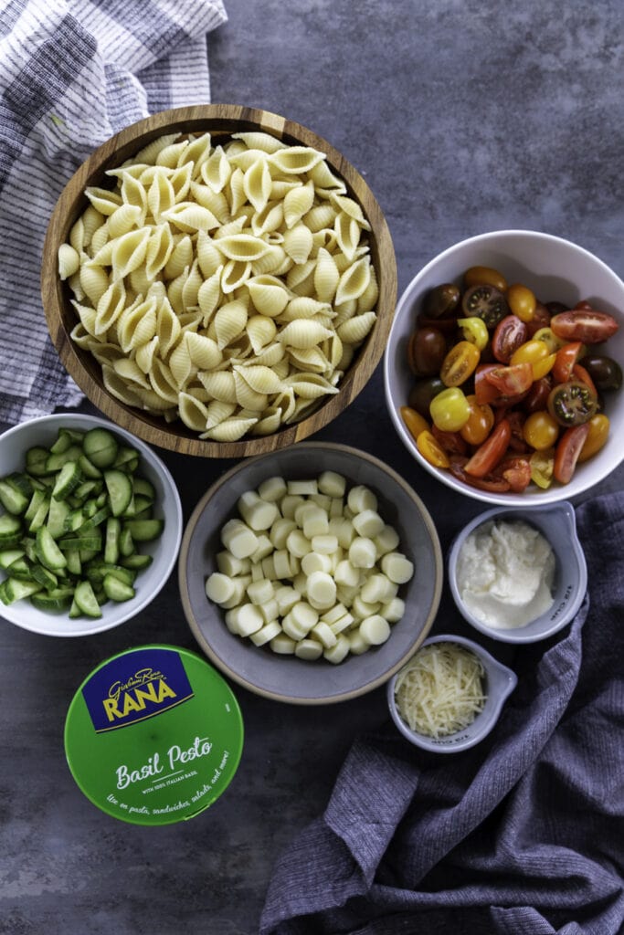overhead shots of ingredients for pesto pasta salad
