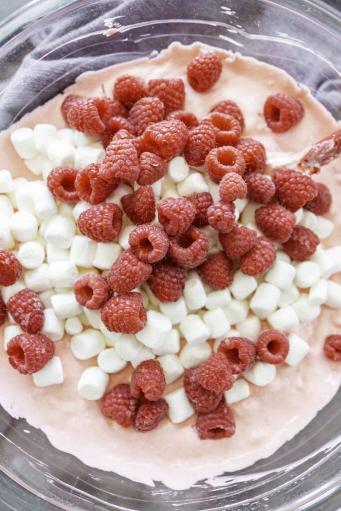 overhead shot jello salad with raspberries and marshmallows