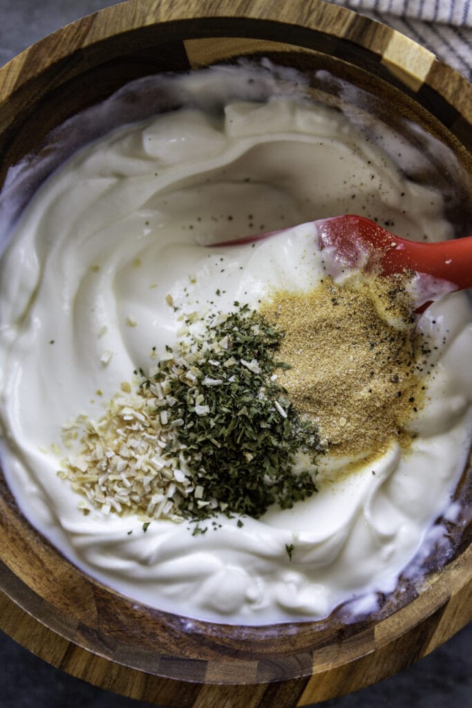 overhead shot of bowl with sour cream and seasonings