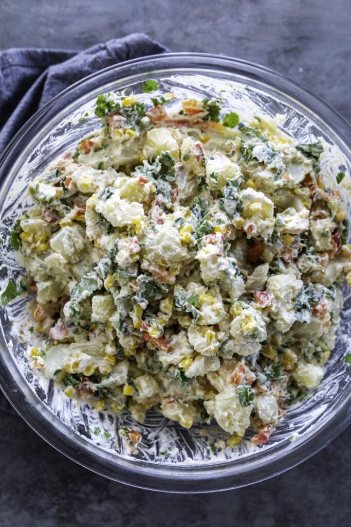 potato salad in glass mixing bowl