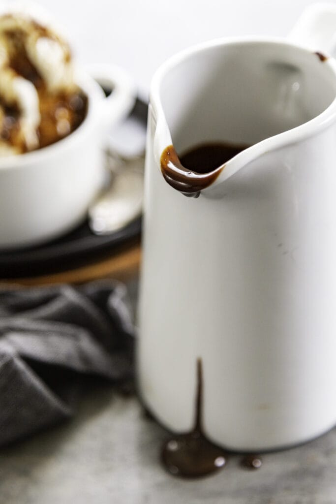 pitcher with hot fudge