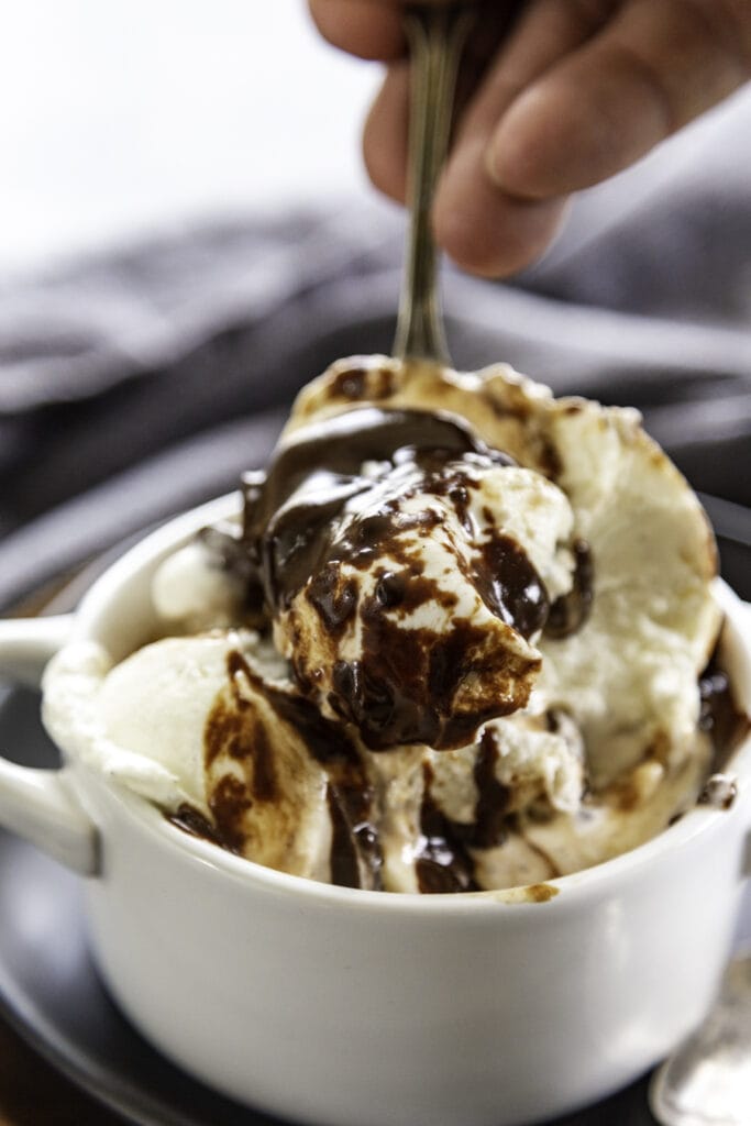 hot fudge on ice cream with spoon