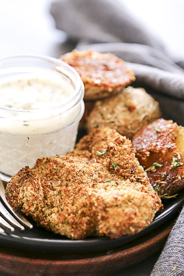 plate of breaded chicken thighs on plate