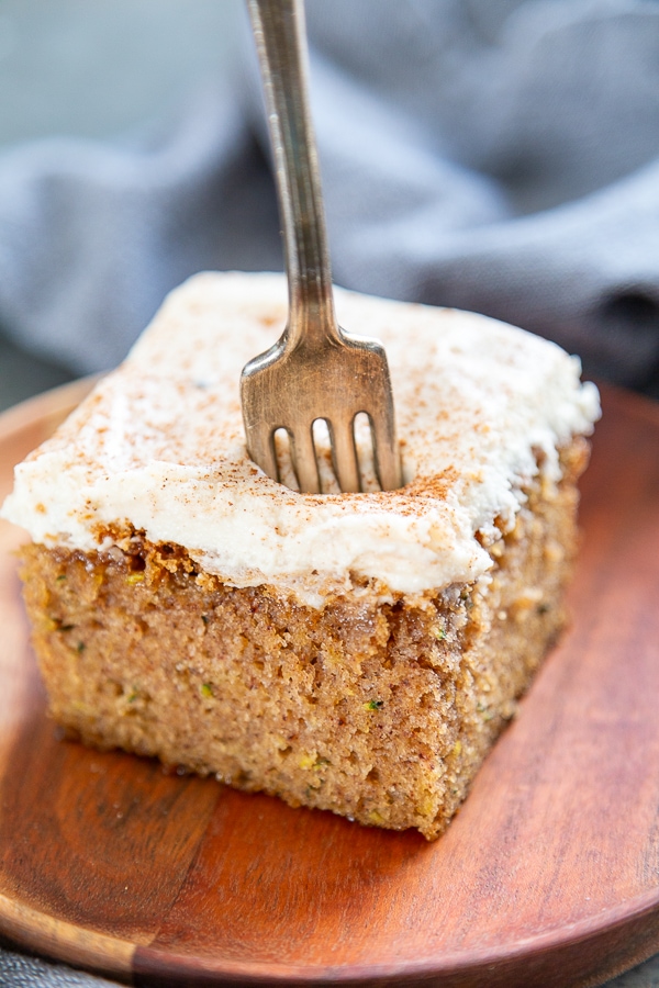 slice of zucchini cake on plate with fork