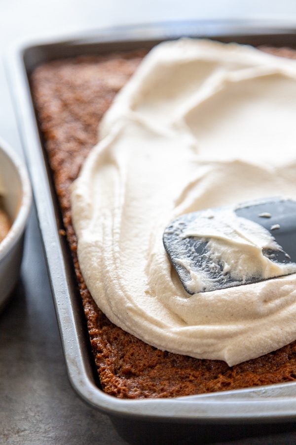 cake in pan with frosting on top