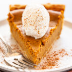 best pumpkin pie recipe topped with whipped cream