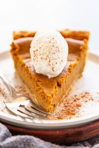 best pumpkin pie recipe topped with whipped cream