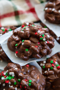 chocolate peanut clusters stack with Christmas sprinkles