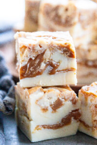 white chocolate fudge with caramel and cashews stack