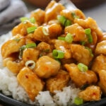 orange chicken on plate with rice