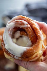 single cinnamon roll with frosting