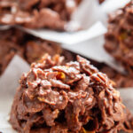 close up picture wooden plate with a no bake chocolate cornflake cookies