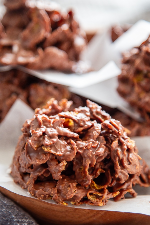 close up picture wooden plate with a no bake chocolate cornflake cookies