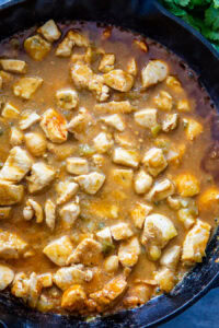 sauce and chicken in skillet