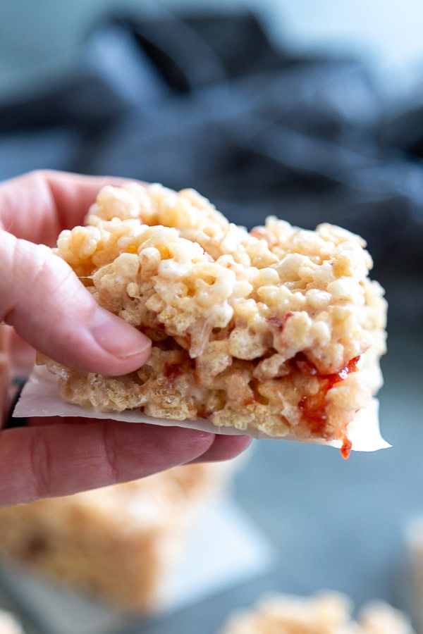 hand holding strawberry rice krispie treat