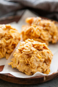 butterscotch cornflake cookies on a plate with parchment paper