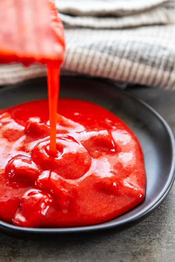 strawberry sauce being poured