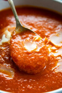 bowl of tomato soup with spoon