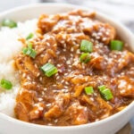 close up picture of teriyaki chicken in white bowl