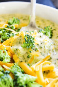 bowl of broccoli and cheese soup with spoon