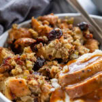 stuffing turkey and mashed potatoes with gravy on a plate