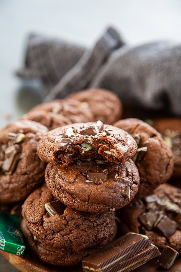 plate of chocolate cookies with bite out of it