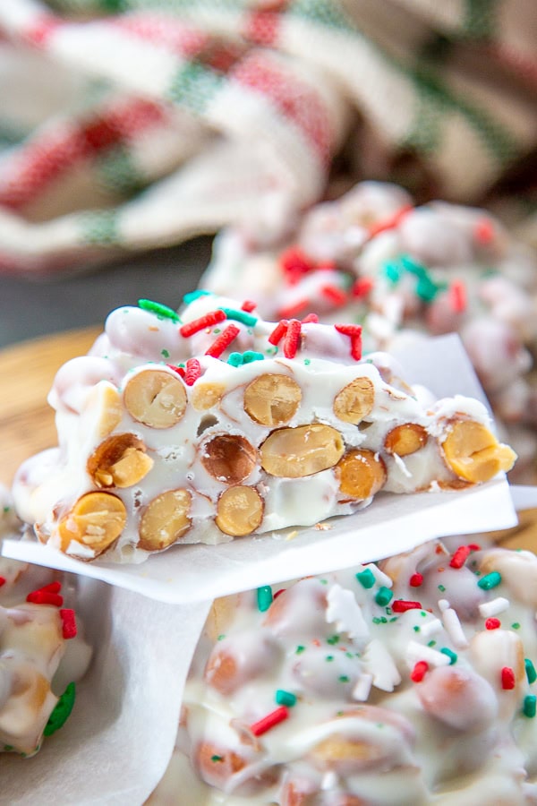 white chocolate peanut cluster cut in half stacked